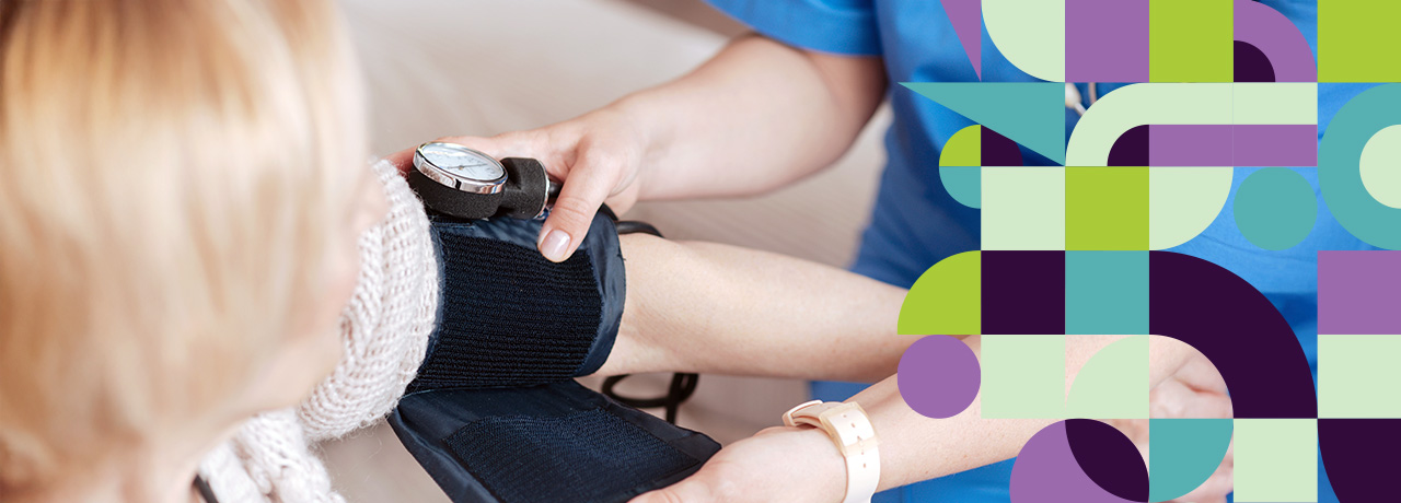 Nurse taking patient's blood pressure