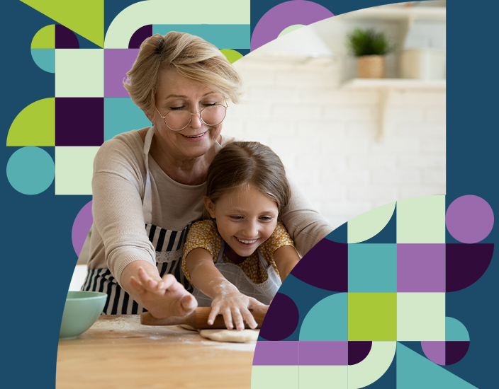 Middle-aged woman enjoying baking with her granddaughter