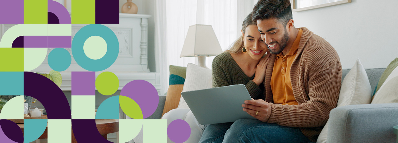 Couple checking medical insurance rates on laptop